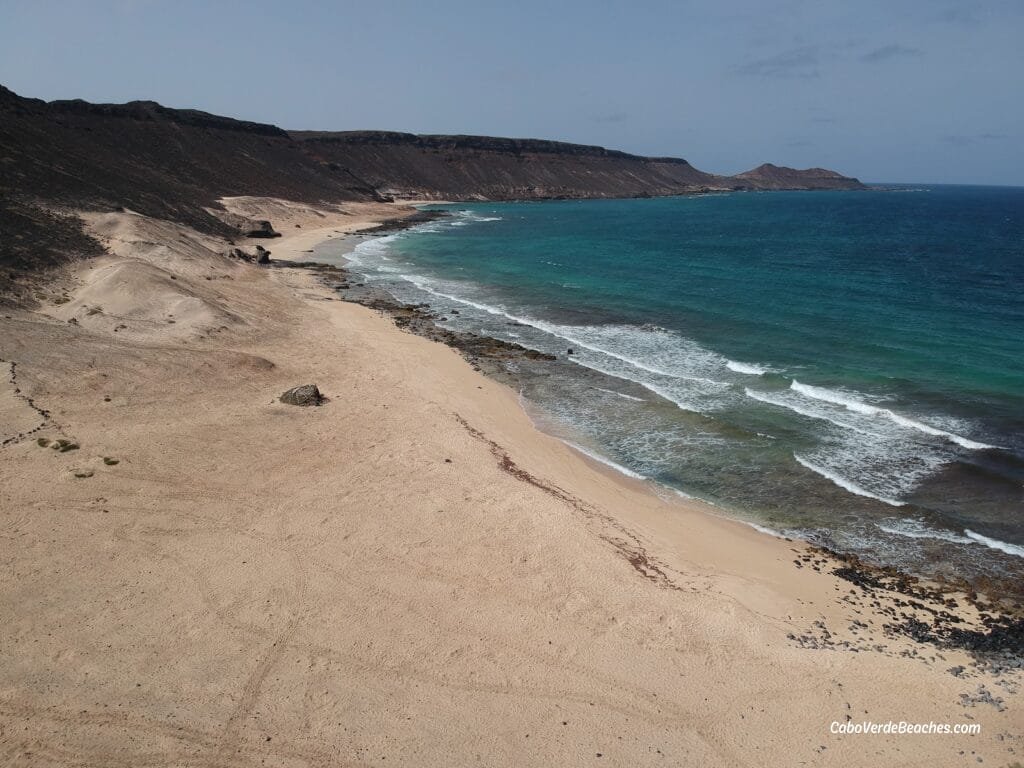 Golden dunes and turquoise waters at the untouched Ponta da Fragata Beach on Sal Island, Cape Verde.
