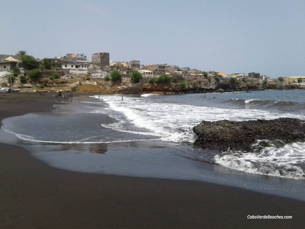 Clarinha Beach in Salinas, Santiago Island, Cape Verde, with black sand, turquoise waters, and a lively atmosphere under the Atlantic sun.