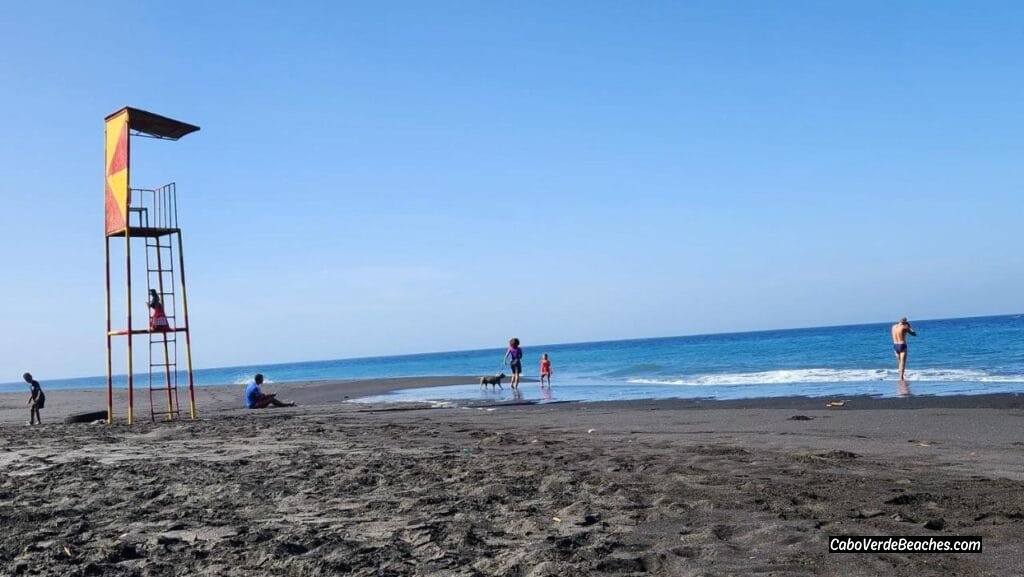 Small beach at Praia do Porto do Vale dos Cavaleiros, with calm ocean water and rocky shores near the ferry port of São Filipe, Fogo Island.