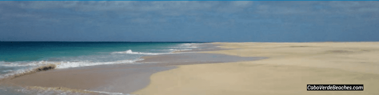 Golden sands and azure waters of Praias da Salina e Bancona, Cape Verde, with remnants of the historic Ponte Velho bridge in the background.