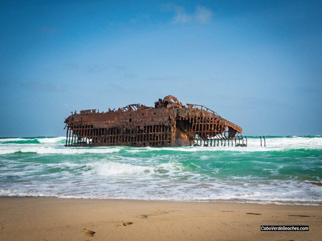 Iconic Praia de Atalanta, Boa Vista: View of the historic Cabo Santa Maria shipwreck against golden sand and turquoise water.