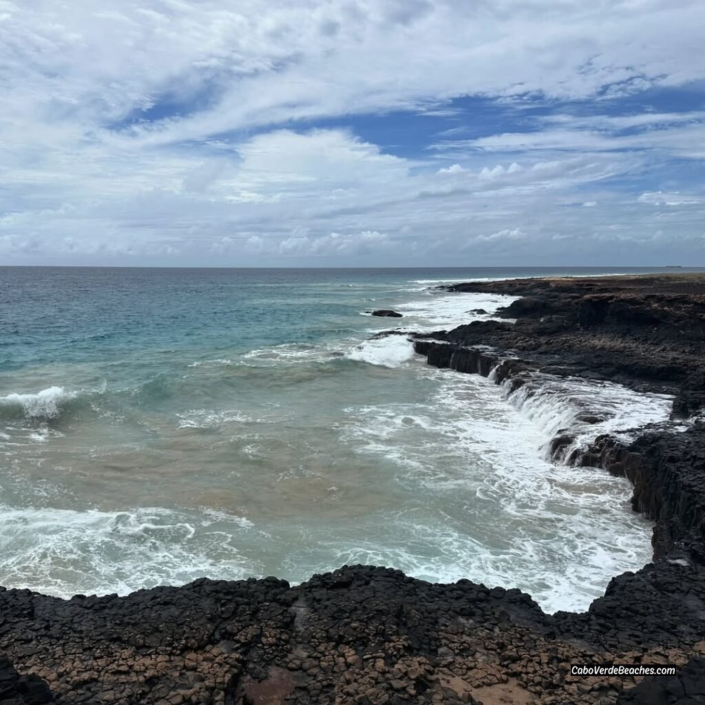 Scenic view of the rugged coastline at Ponta de Medronho, Boa Vista, Cape Verde, overlooking the serene golden sands of Medronho Beach