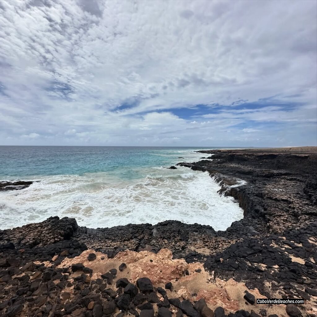 Ponta de Medronho coastal view showcasing the tranquil turquoise waters and soft sands of Medronho Beach, a hidden gem for solitude in Cape Verde.